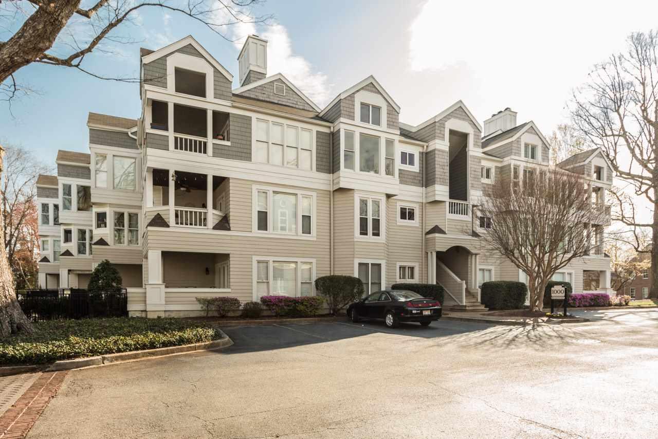 1000 Brighthurst Drive, Unit 301 Raleigh, NC 27605 - Photo 24 of 24 a front view of a residential apartment building with a yard