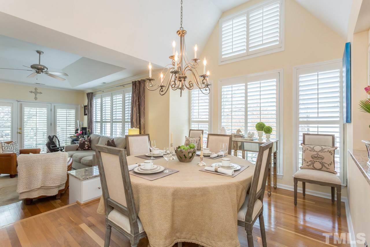 1000 Brighthurst Drive, Unit 301 Raleigh, NC 27605 - Photo 7 of 24 a view of a dining room with furniture window and outside view