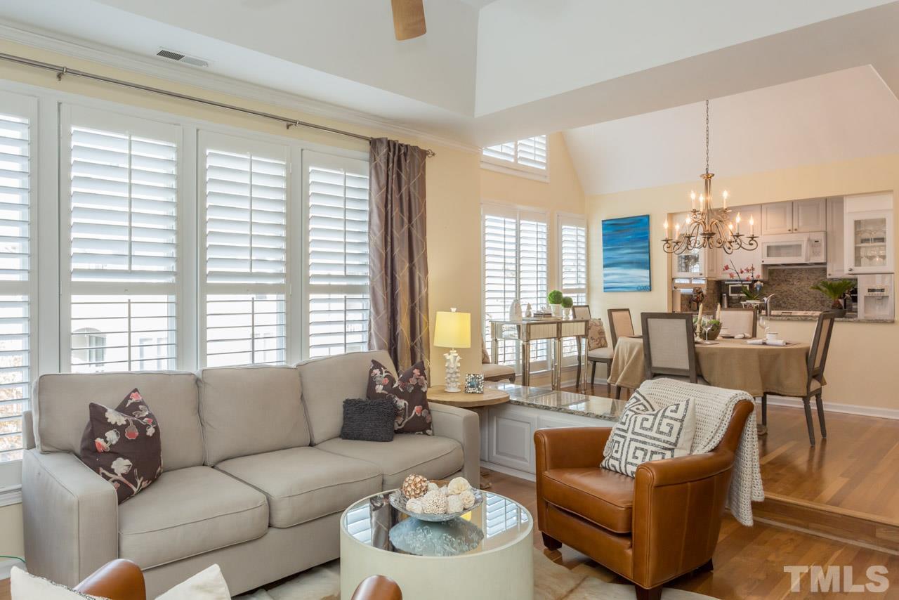 1000 Brighthurst Drive, Unit 301 Raleigh, NC 27605 - Photo 9 of 24 a living room with furniture and a large window