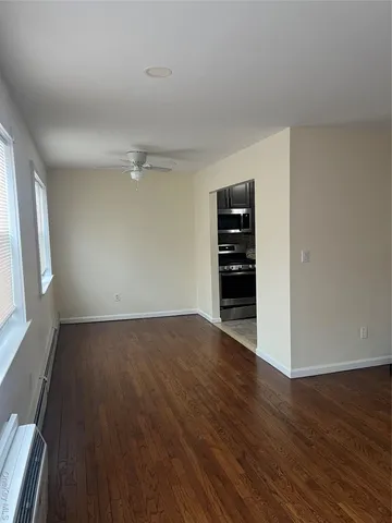 a view of entryway with stairs and wooden floor