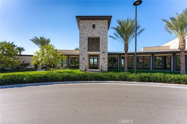 a front view of house with a garden