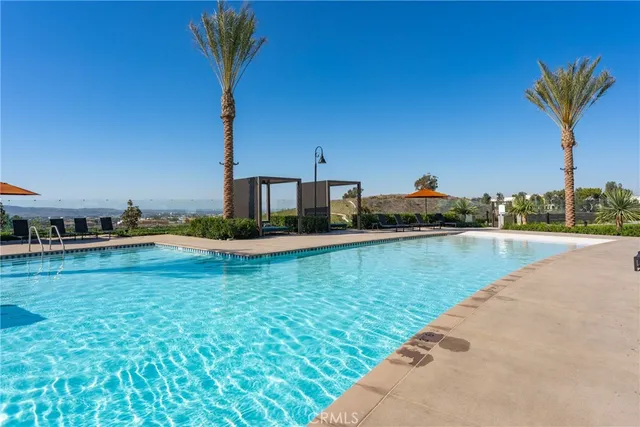 a view of a swimming pool and a yard