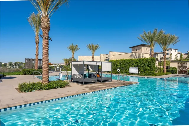 a view of a backyard with plants and a patio