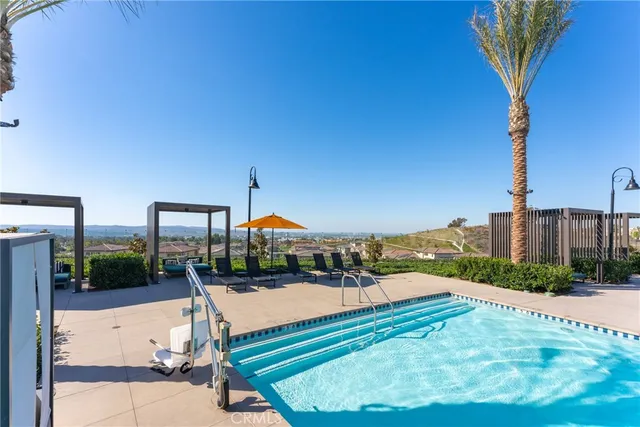 a park view with a large tree and wooden fence