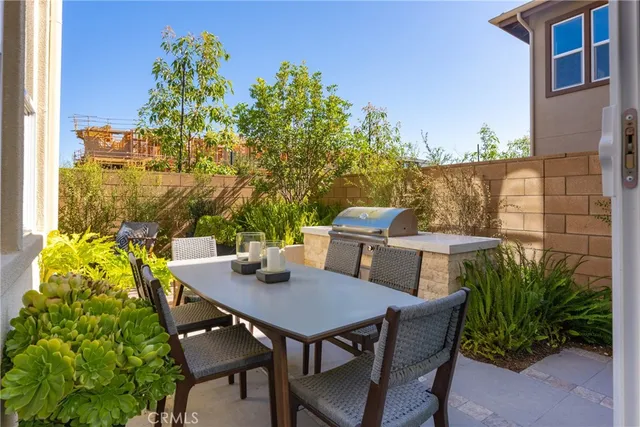 a view of an outside dining space with furniture