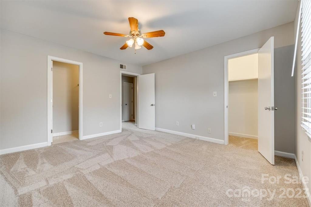 3722 Park Road, Unit I Charlotte, NC 28209 - Photo 23 of 27 a view of an empty room with a chandelier fan