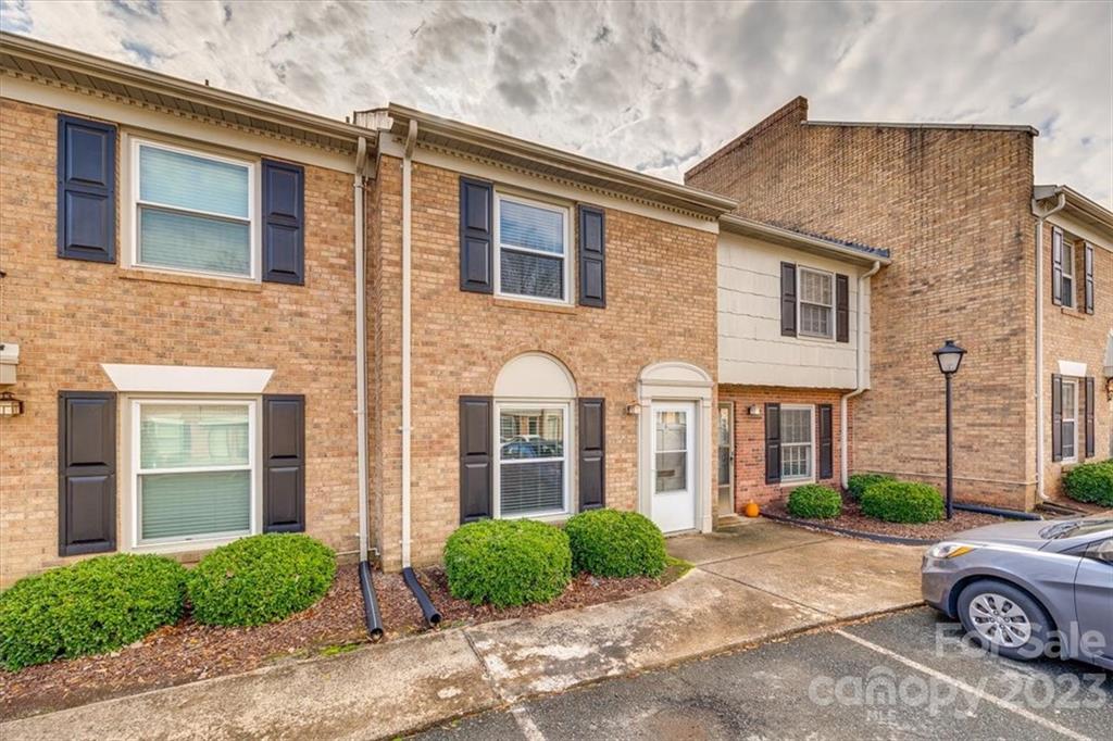 3722 Park Road, Unit I Charlotte, NC 28209 - Photo 27 of 27 a car parked in front of a brick house