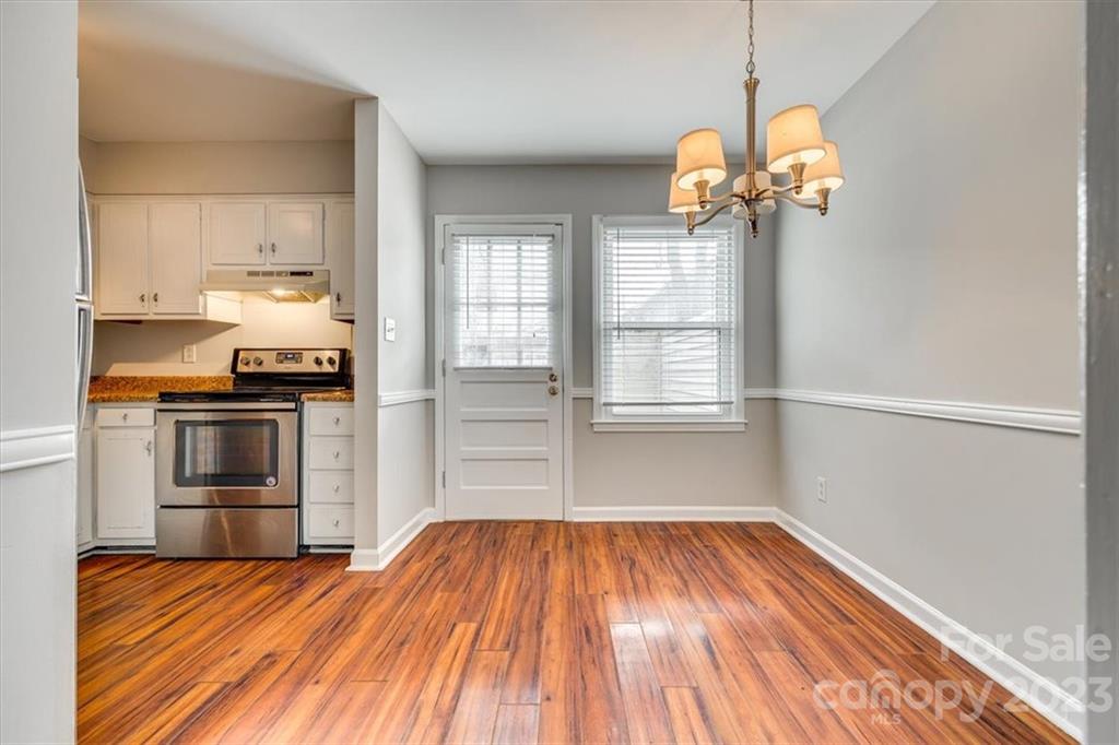 3722 Park Road, Unit I Charlotte, NC 28209 - Photo 8 of 27 a view of a kitchen with a sink wooden floor and a window