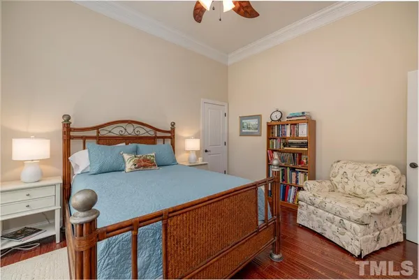 a bedroom with furniture and a book shelf