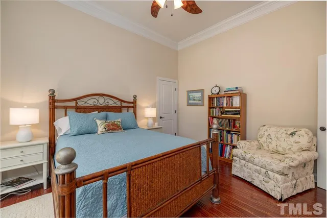 a bedroom with furniture and a book shelf