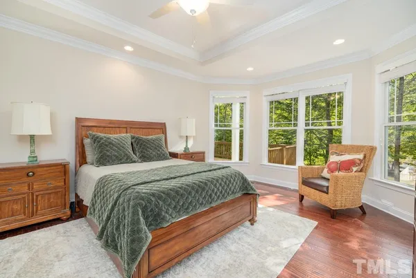 a spacious bedroom with a large bed and a couch