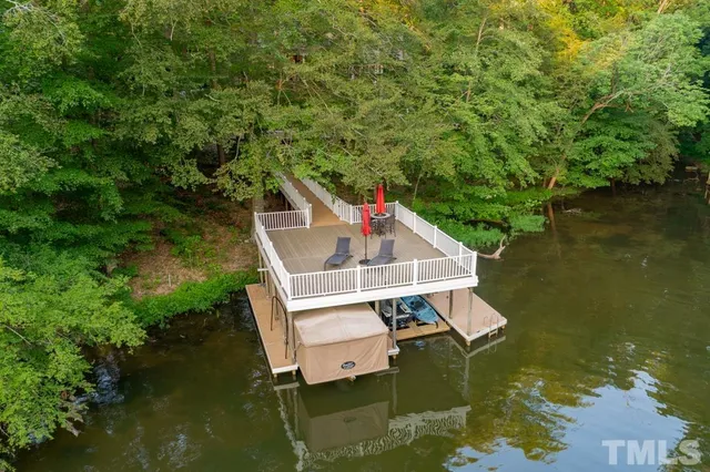 a living room with furniture ceiling fan and a rug