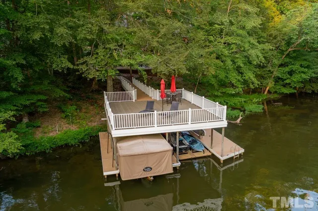 a balcony with furniture and a potted plant