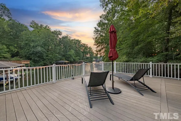a view of a wooden deck with furniture
