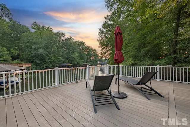 a view of a wooden deck with furniture