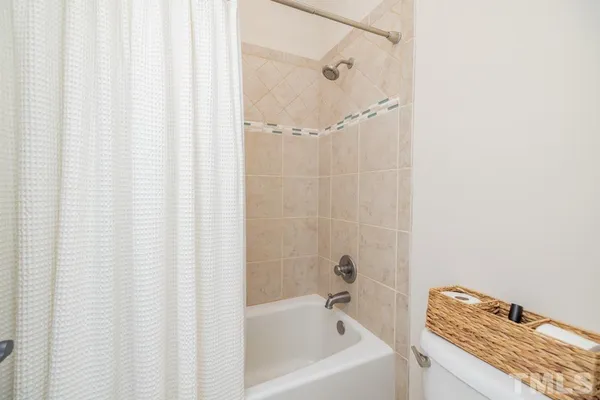 a bedroom with bunk bed and a window