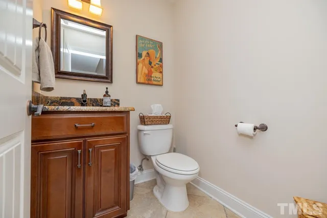 a bedroom with a bed and a desk