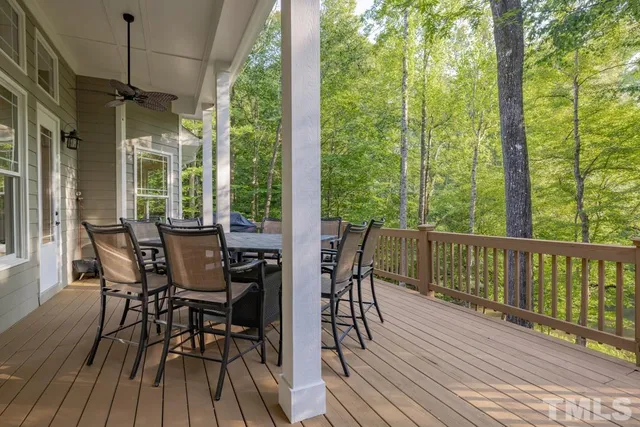 a view of a backyard with sitting area