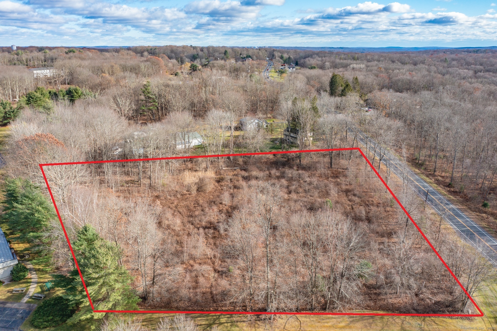 317 Merrow Road Tolland, CT 06084 - Photo 6 of 13 a view of a dry yard with wooden fence
