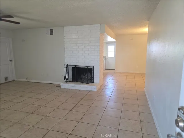 an empty room with fireplace