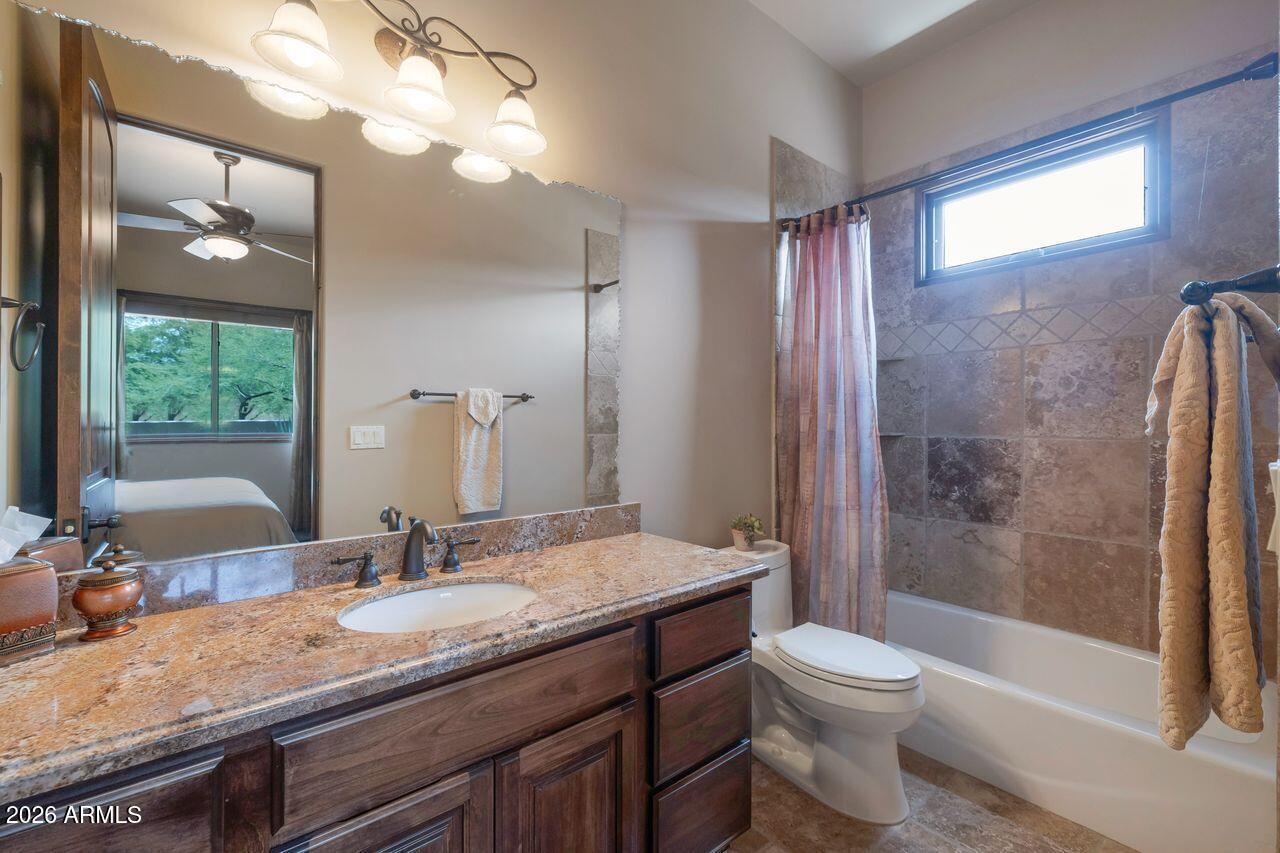 18507 East Picacho Road Rio Verde, AZ 85263 - Photo 27 of 33 a bathroom with a granite countertop sink toilet and shower