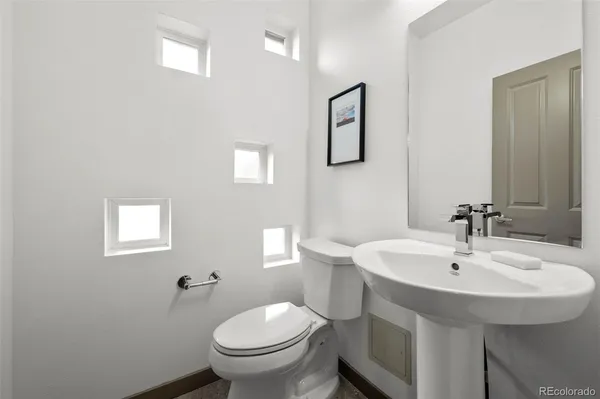 a bathroom with a sink and toilet