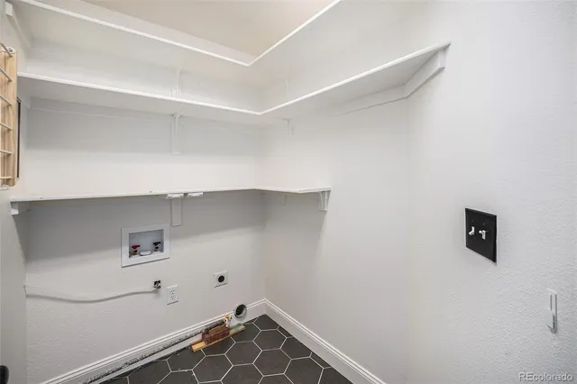 a view of storage and utility room with empty racks