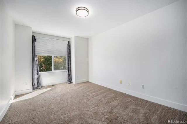 an empty room with large window