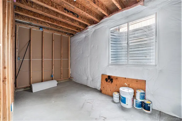 a view of an empty room with a fireplace