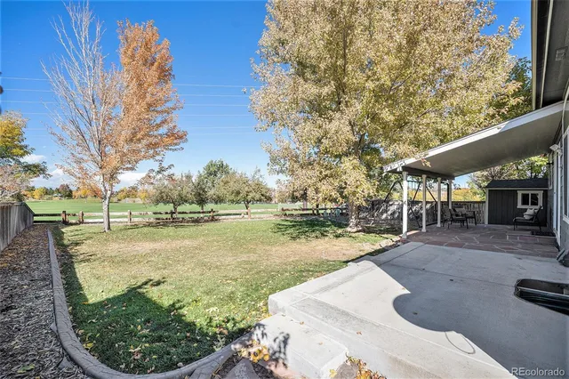 a view of a patio with a yard