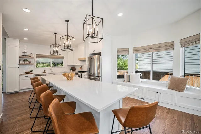a view of kitchen with dining table and chairs