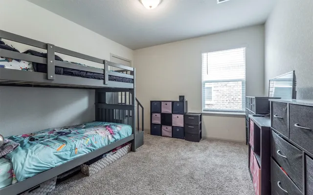 a bedroom with a bed and furniture