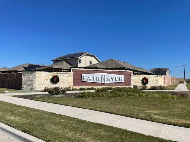 a view of a street with big yard