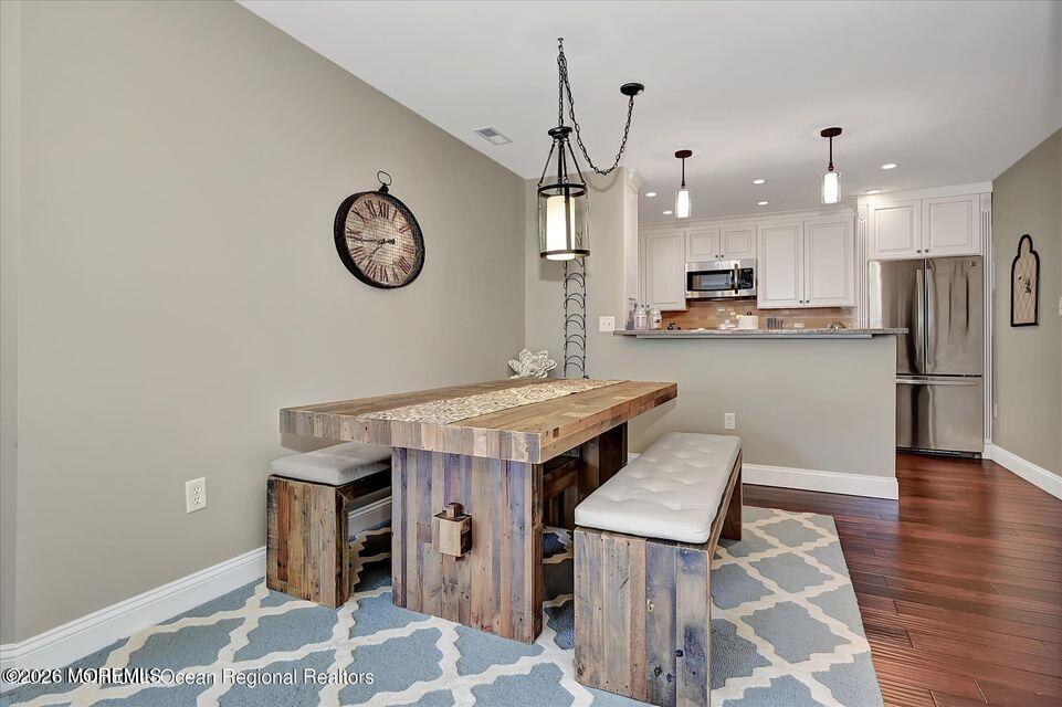 13 Racquet Road Wall, NJ 07719 - Photo 11 of 20 a kitchen with stainless steel appliances granite countertop a chimney a stove and a refrigerator
