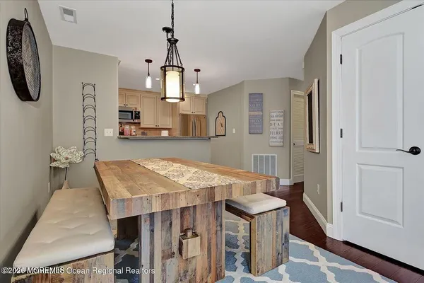 a open kitchen with a table and chairs