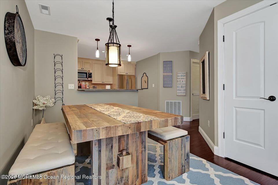 13 Racquet Road Wall, NJ 07719 - Photo 12 of 20 a open kitchen with a table and chairs