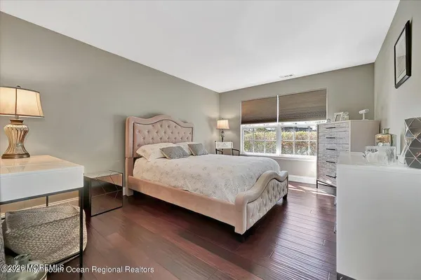 a bedroom with a bed and a table in it