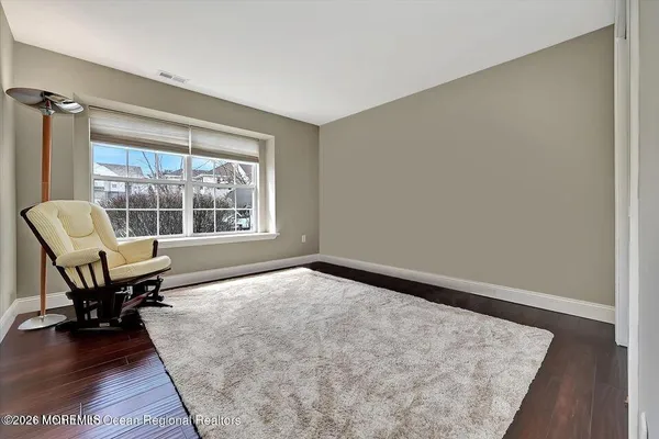 wooden floor in a room with a window