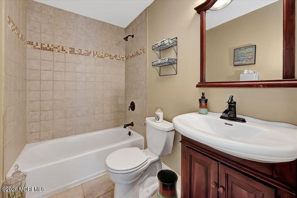 13 Racquet Road Wall, NJ 07719 - Photo 20 of 20 a bathroom with a sink a toilet and bathtub