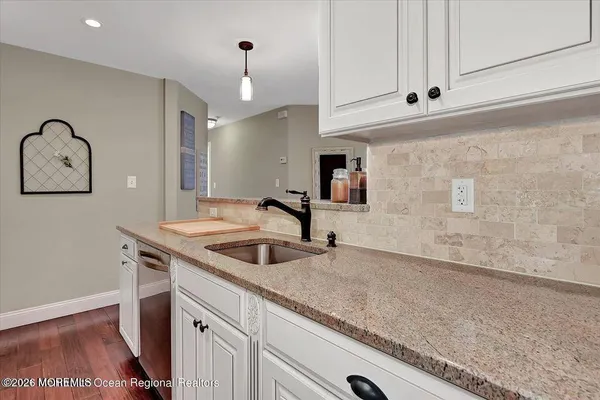 a kitchen with a sink and cabinets