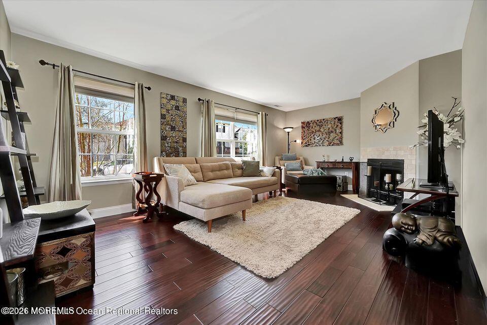 13 Racquet Road Wall, NJ 07719 - Photo 7 of 20 a living room with furniture and a flat screen tv