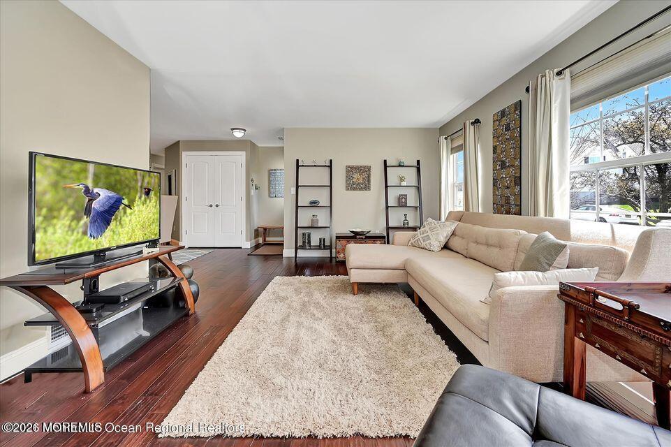 13 Racquet Road Wall, NJ 07719 - Photo 9 of 20 a living room with furniture flat screen tv and a large window
