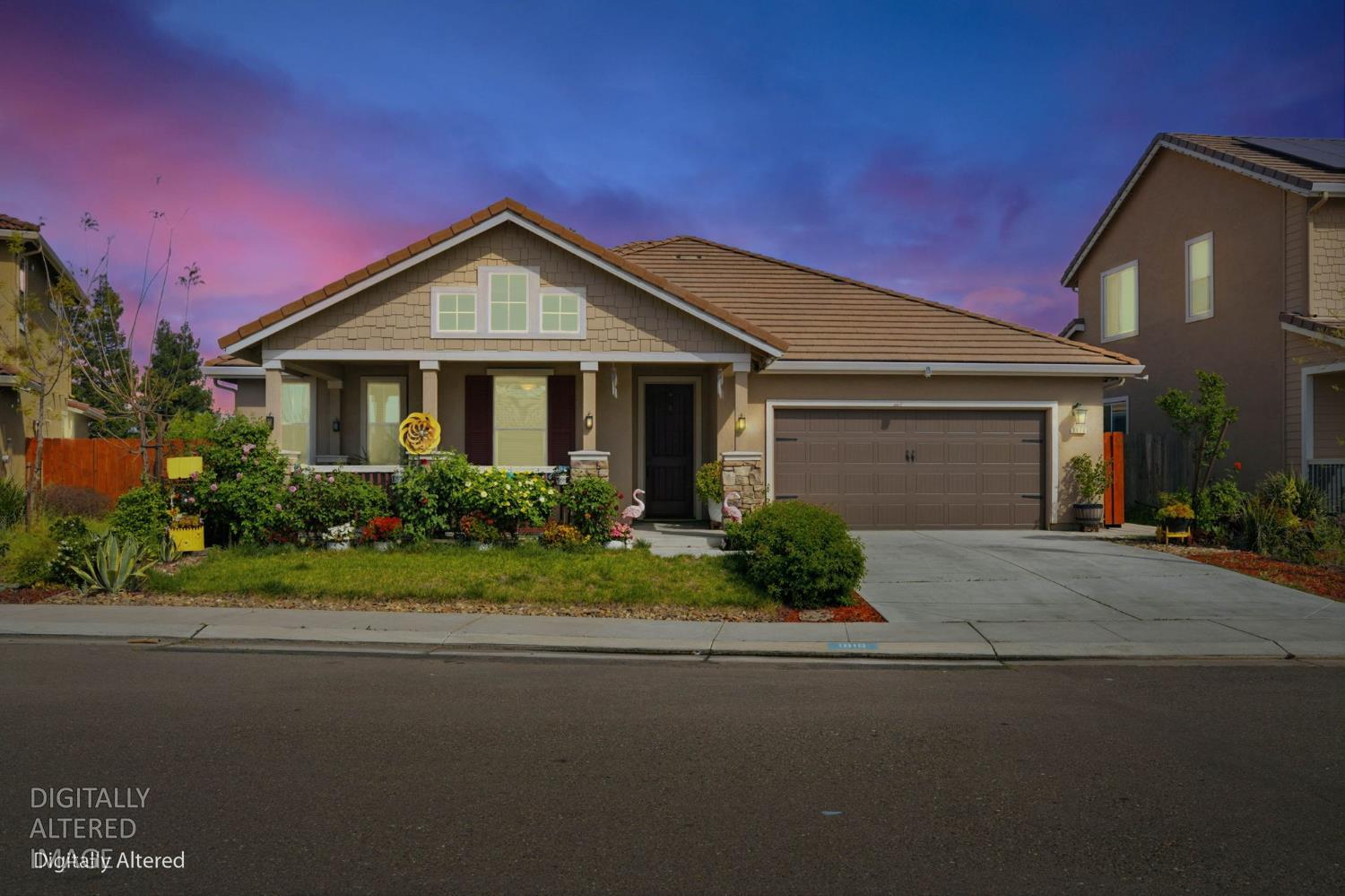 1816 Fire Power Avenue Manteca, CA 95337 - Photo 1 of 38 a front view of a house with garden