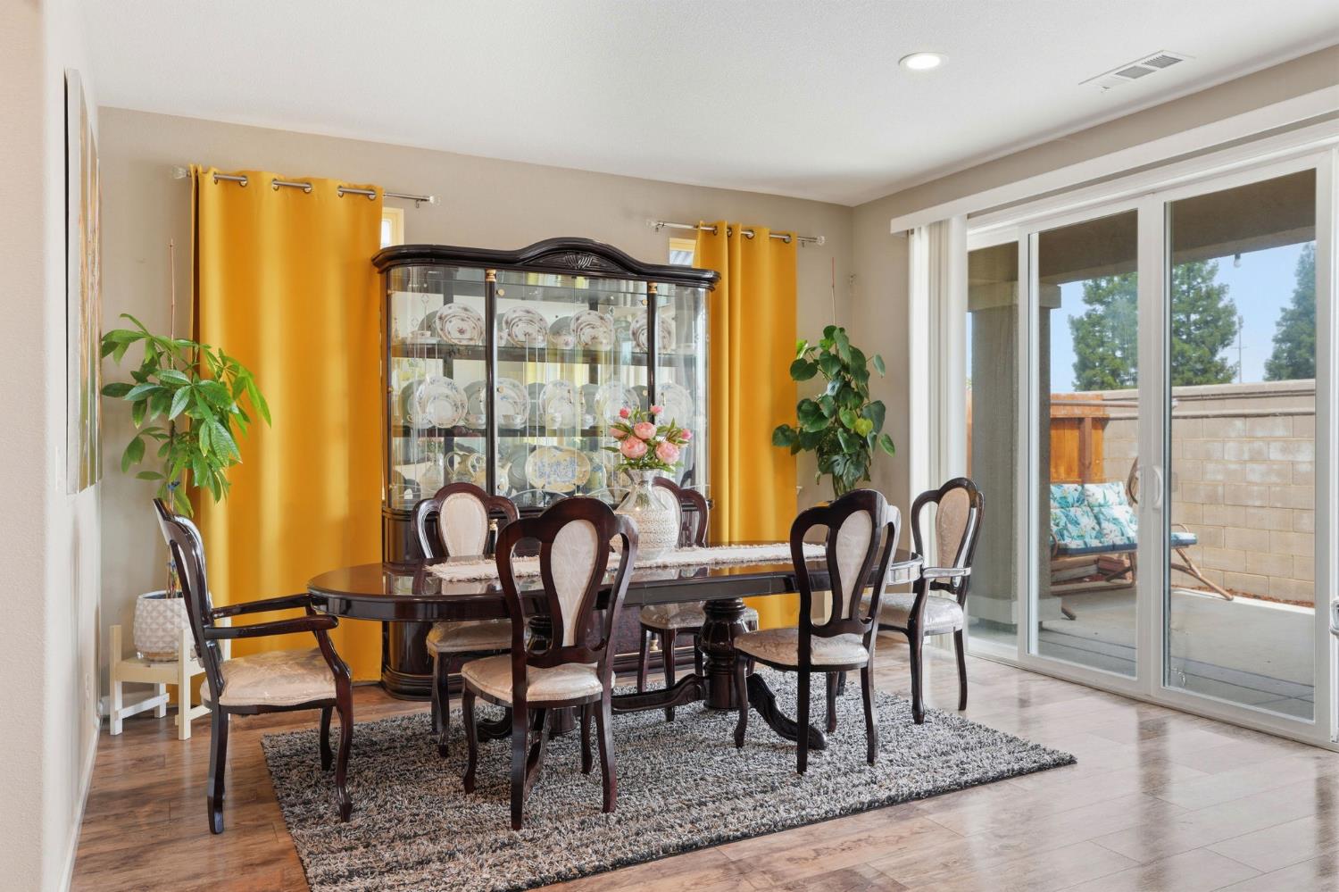 1816 Fire Power Avenue Manteca, CA 95337 - Photo 18 of 38 a view of a dining room with furniture window and outside view