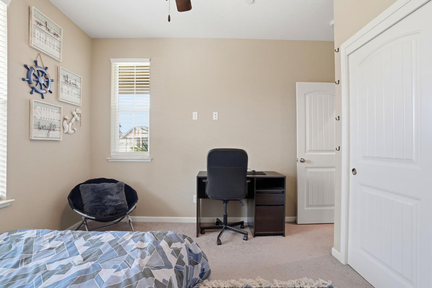 1816 Fire Power Avenue Manteca, CA 95337 - Photo 24 of 38 a bedroom with a bed and a chair