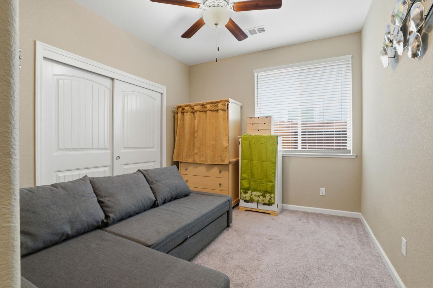 1816 Fire Power Avenue Manteca, CA 95337 - Photo 31 of 38 a living room with furniture and a window