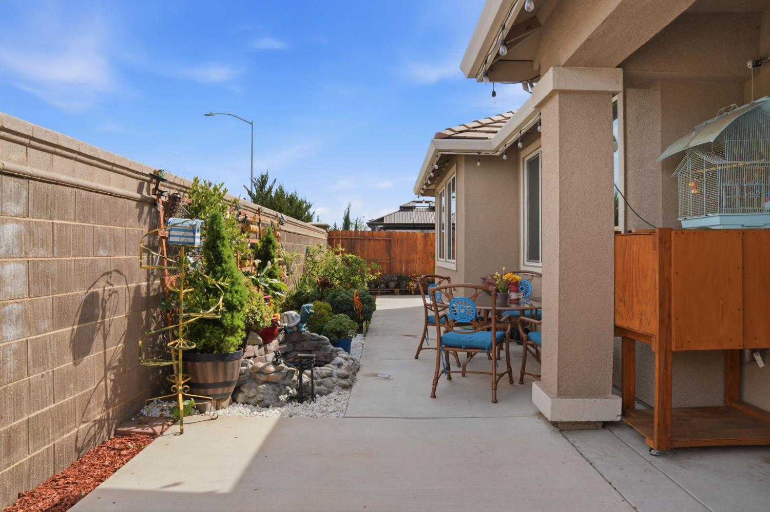 1816 Fire Power Avenue Manteca, CA 95337 - Photo 34 of 38 a view of a patio with chairs and potted plants