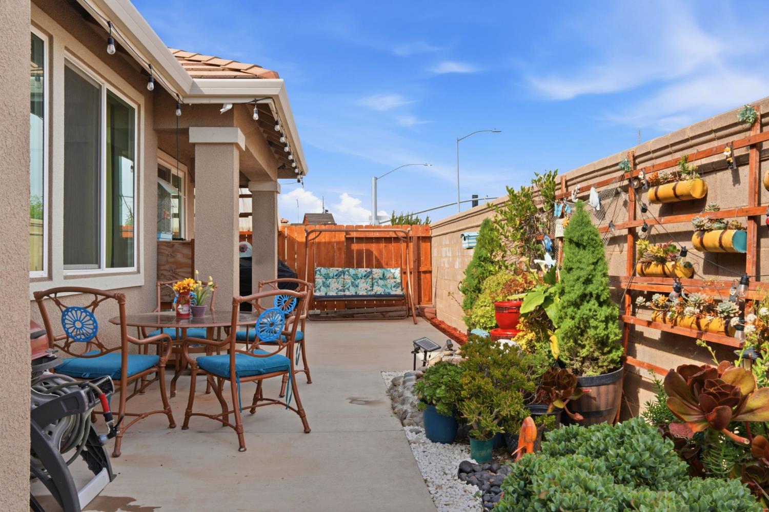 1816 Fire Power Avenue Manteca, CA 95337 - Photo 36 of 38 a outdoor space with patio furniture and potted plants