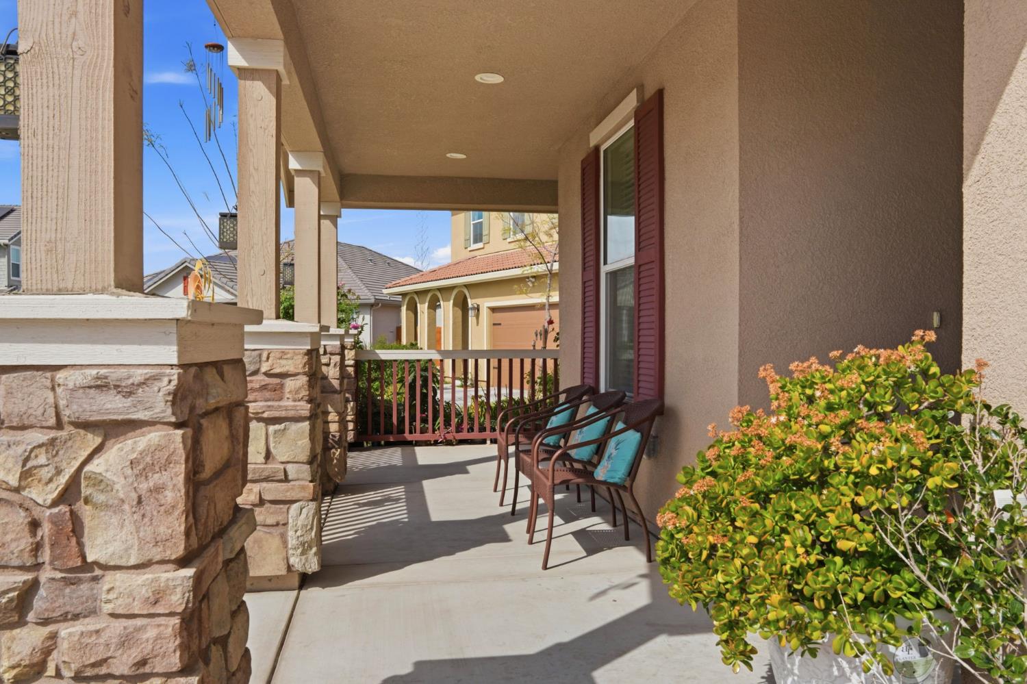 1816 Fire Power Avenue Manteca, CA 95337 - Photo 5 of 38 a balcony with table and chairs and potted plants