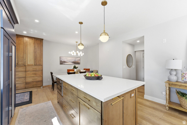 7935 Mustang Loop Road Park City, UT 84098 - Photo 21 of 60 Kitchen island with a white countertop and integrated microwave